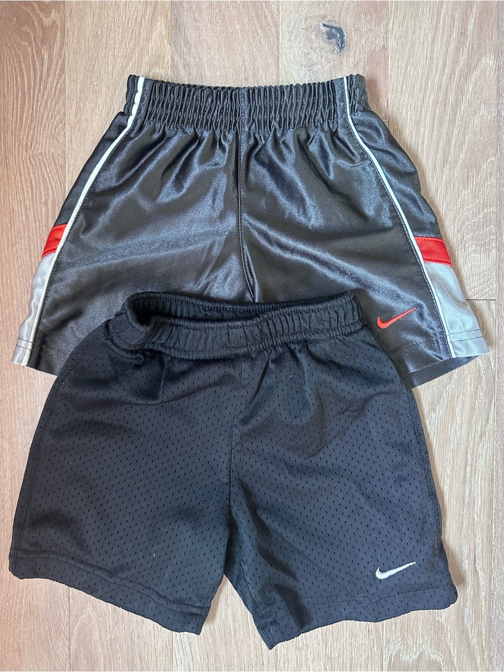 Nike Kids Black Athletic Shorts with orange Accent